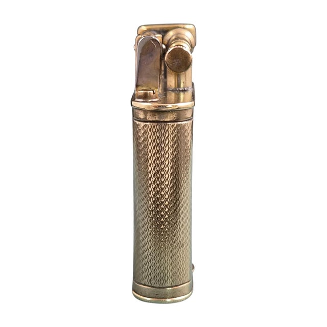 Early art deco dunhill unique b petrol pocket lighter, manufactured circa 1926–1928. the rectangular gold-plated brass...