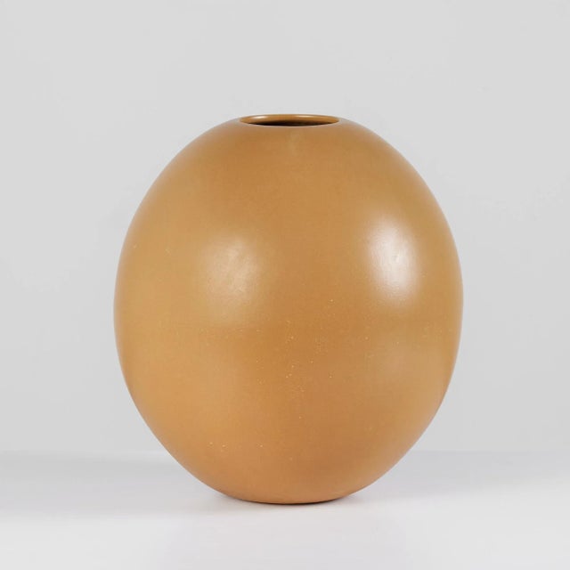 Fabulous rounded glazed planter in gold by ceramics artist Marilyn Kay Austin for Architectural Pottery. This example,...