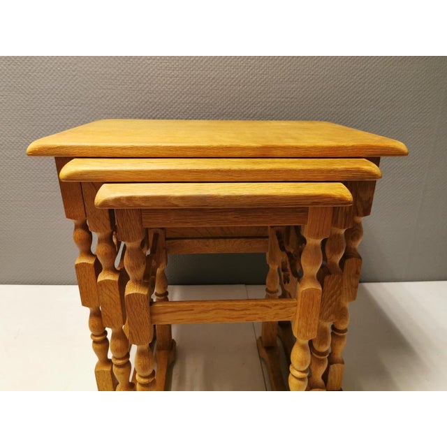 3 nesting tables in solid oak with carvings, designed by Henry Kjærnulf (1911-1975). Apparently manufactured at Nyrup...