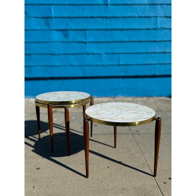 Bring a touch of mid-century design to your home with this incredible set of nesting tables. From the sweet tapered legs...