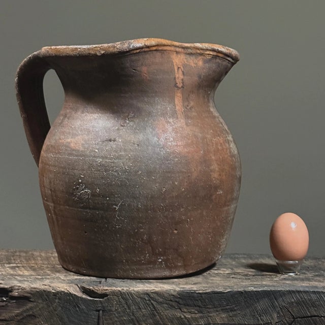 19th Century Portuguese Redware Pitcher from Vidigueira This 19th-century Portuguese redware pitcher exemplifies the...