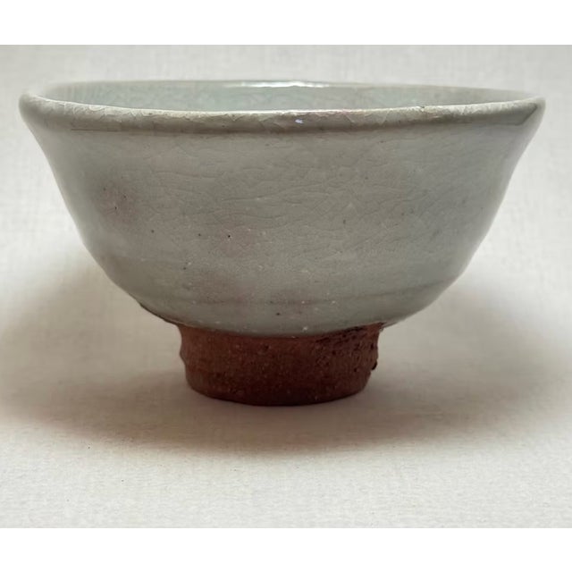 Handmade Hagi ware matcha bowl (萩焼 chawan) by Japanese potter Issai Saito, thrown in the Hagi tea-ware tradition. Measures...
