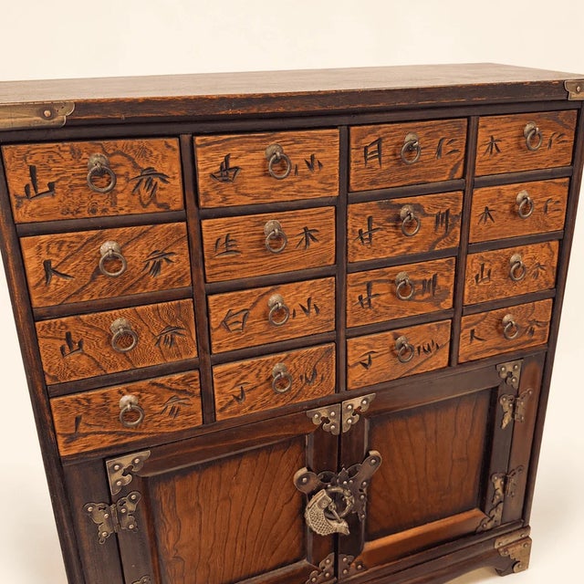 Vintage Korean Elm Medicine Chest, 16 Carved Drawers, Brass Fish Lock For Sale - Image 4 of 10