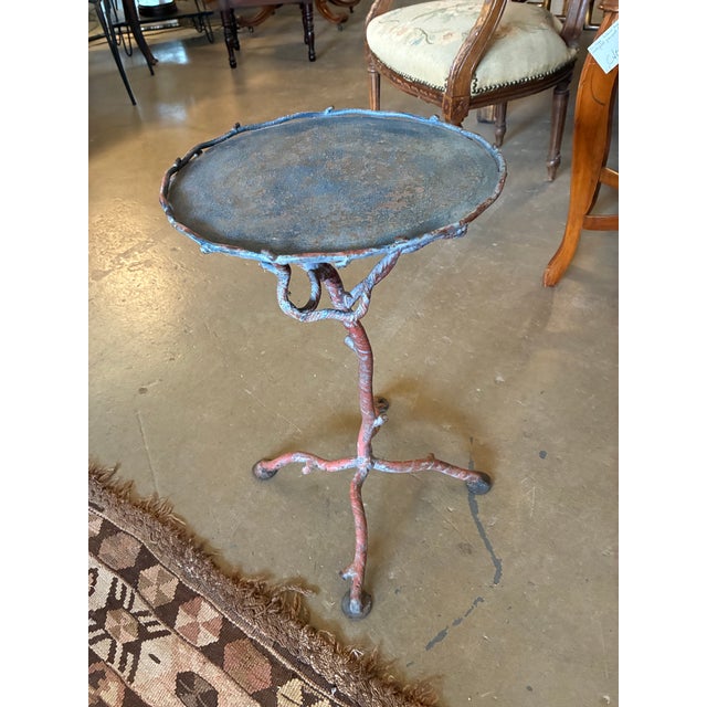 Footprint measurements on floor: Height - 19.75” x width at feet 15”. Diameter at top of table is 12.25”. Brutalist style...