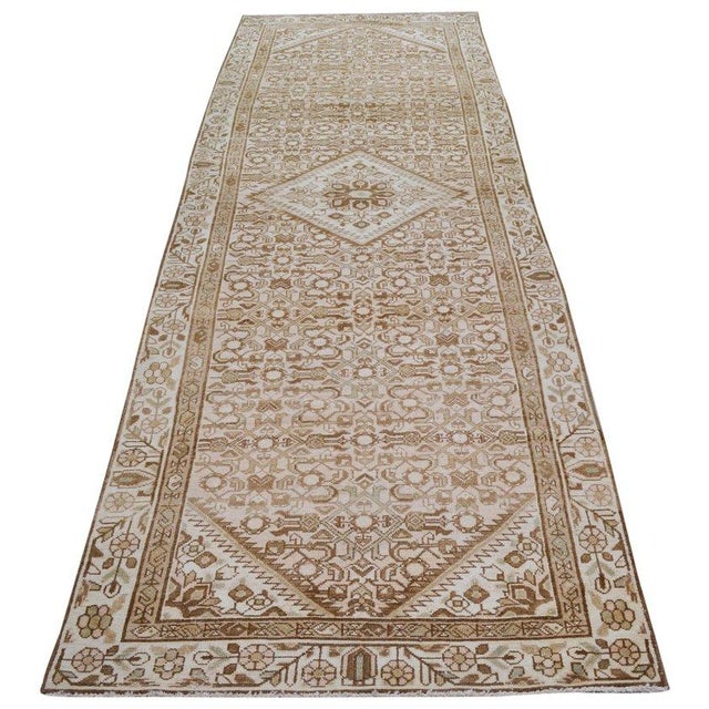 Hand-knotted with care using traditional rug-making techniques, this wool rug blends timeless craftsmanship with a modern...