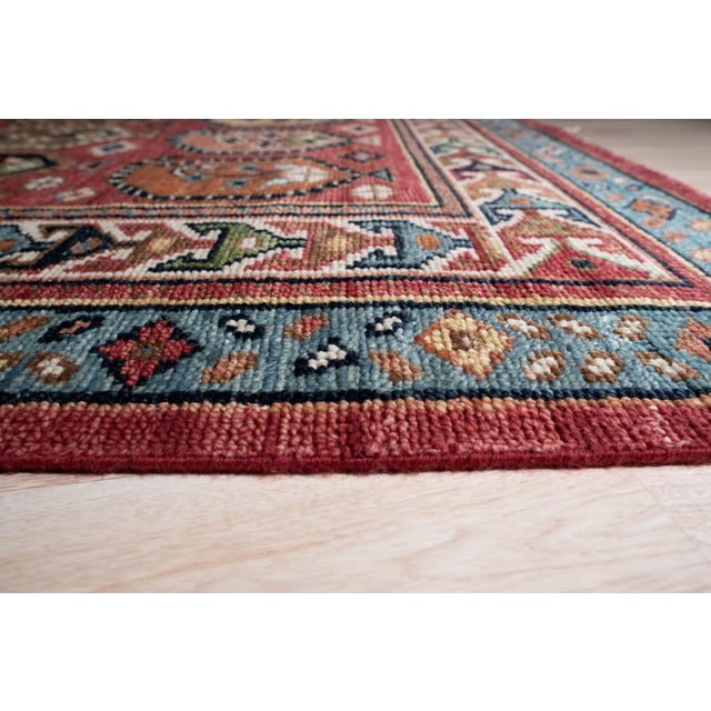 Kira Traditional Coral Hand Knotted Wool Rug, Country of Origin: India. This exquisite piece showcases the enduring...