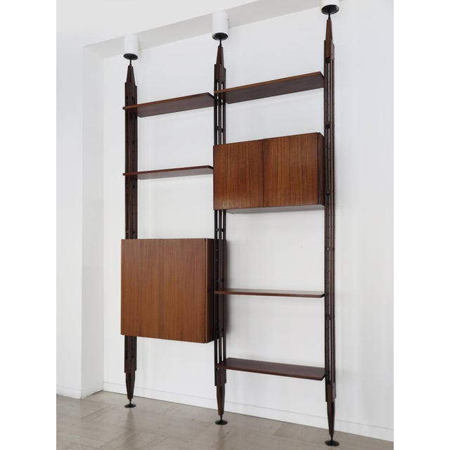 Walnut bookcase, model LB7, with two bays, designed by Franco Albini for Poggi Pavia in the late 1950s, composed of five...