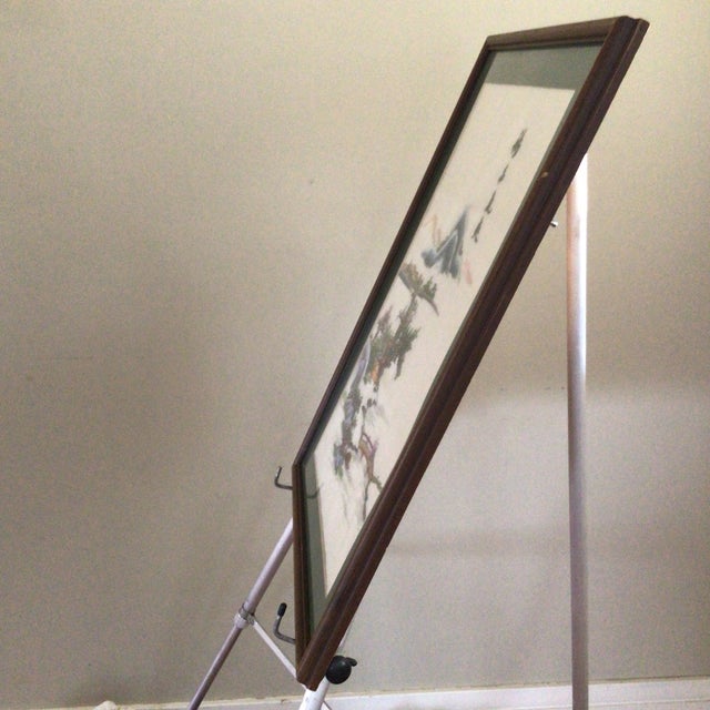 Framed Asian silk thread river and landscape scene.