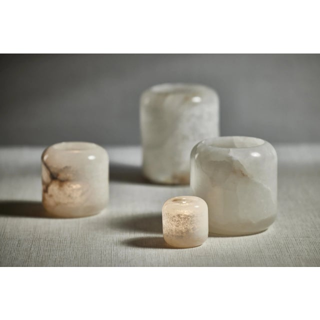 Crafted from natural alabaster, this candle holder beautifully illuminates the glow of a single votive candle. Striking on...