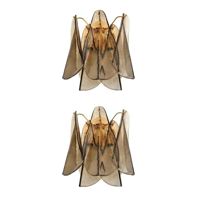 Scenographic and luxury murano glass wall sconces, set of two. “rondini” elements in murano glass poured over a mold from...