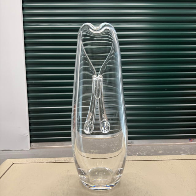 This listing is for two authentic Steuben crystal pieces. First, a Model 8077 split-handle martini pitcher, which was...