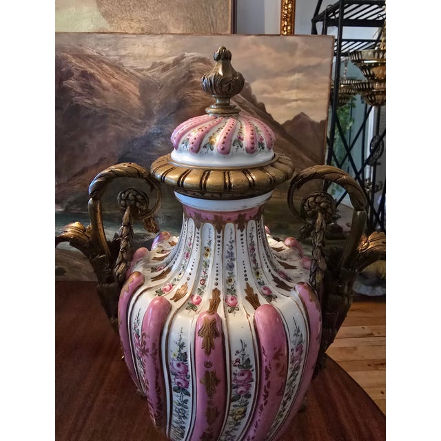 A museum quality antique signed sevres urn set of two ( guaranteed over 150 years old , beautifully matched with the blue...