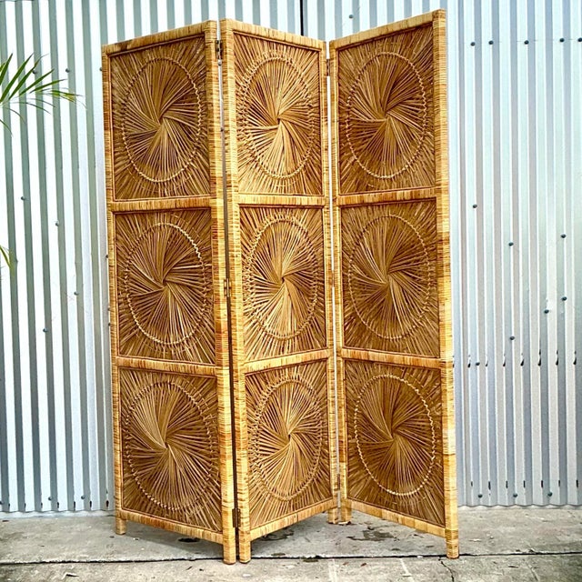 Bring coastal charm and bohemian elegance to your home with this Vintage Coastal Woven Rattan Folding Screen. Crafted from...