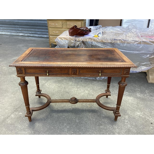 This Louis XVI style 19th century desk is both functional and elegant. With hints of remaining gold-leaf accents, this...