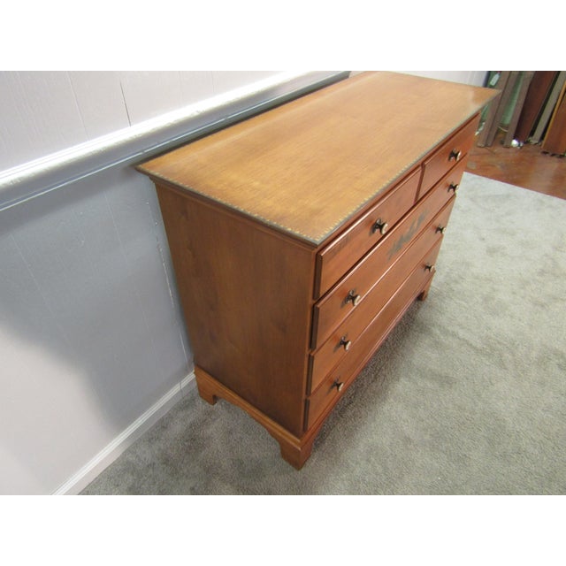 Item 87115: Hitchcock solid maple chest of drawers. Age: 1990's. Details: Gold paint decoration. Condition: Very clean...
