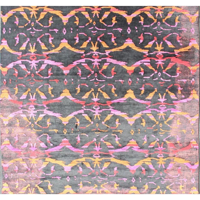 This modern Indian rug has been hand-knotted in wool and features an all-over, sub-geometric design rendered in purple,...