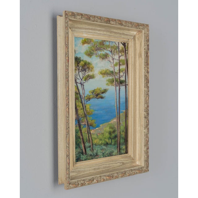 A Mid Century painting by French artist Benjamin Sarraillon (1902-1989) depicting a coastal landscape with a hilltop view...