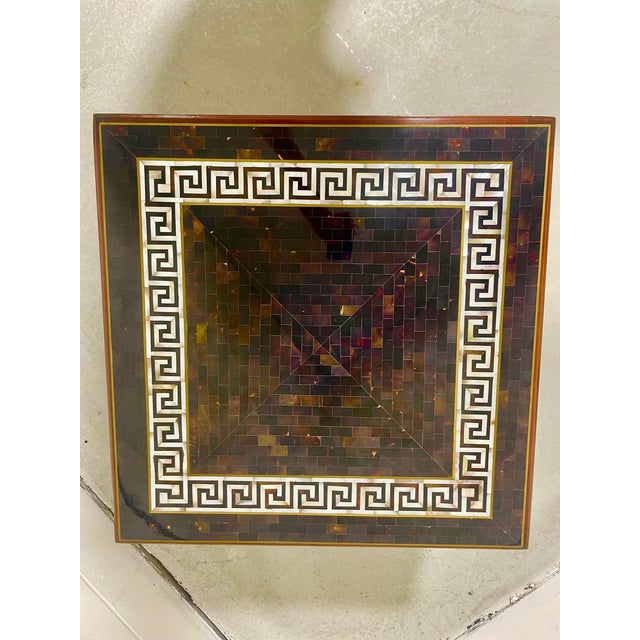 This stunning table was made by Maitland-Smith Furniture (though it has no label) and features an elaborate geometric...