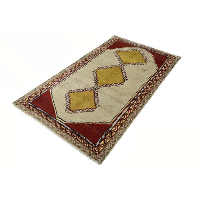 A characterful piece of nomadic knotting art: This hand-knotted Gabbeh Qashghai rug impresses with its strong colors and...