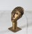 Vintage Ghanaian brass mask head on a pedestal. Maker mark on bottom. Minor age wear.
