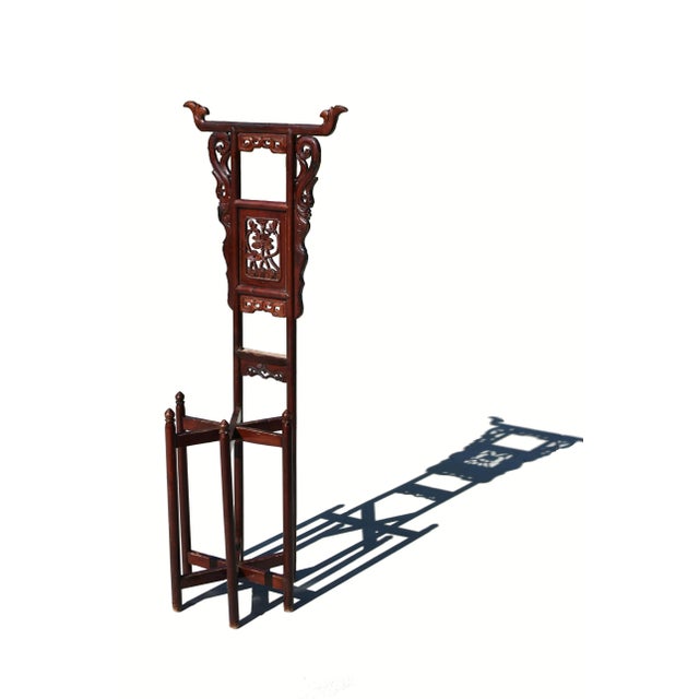 A beautiful 19th century Chinese wash stand of solid fir wood, hand carved with peonies in the center splat. Under the top...