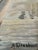 This original vintage seascape oil painting, from around 1930, shows a sailing boat, a coastal castle and distant ships on...