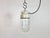 Vintage industrial light made in former Czechoslovakia during the 1970s. It features a white porcelain top and a glass...