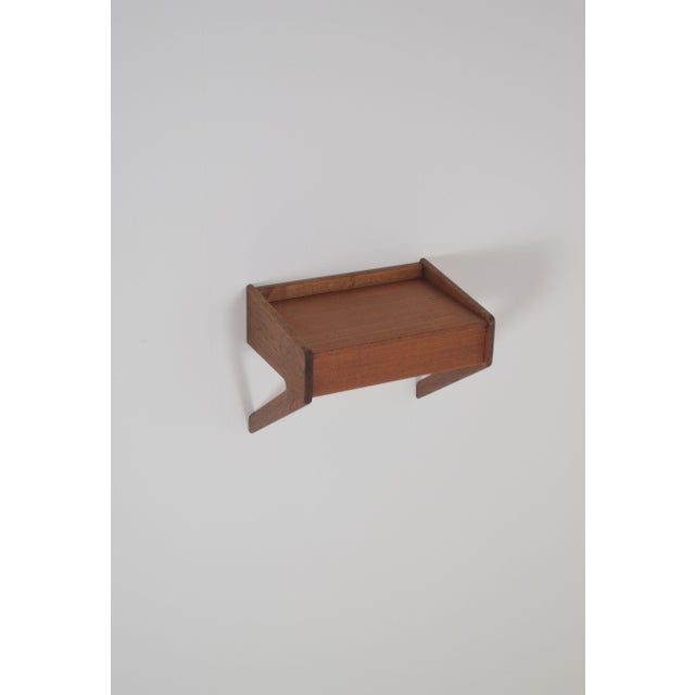 Floating bedside table designed by Sigfred Omann in the 1960s. This piece of furniture was manufactured by the Danish...