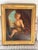 Impressive antique-style European oil on canvas depicting a youthful allegorical figure of Painting, seated at an easel...