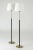 This is a pair of elegant floor lamps from Falkenbergs Belysning, made from brass. The sleek stems are dressed with black...