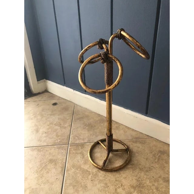 Experience luxury with our Hollywood Regency Italian Gold Gilt Rope and Tassel Towel Stand. Made with high-quality...