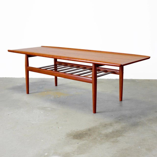 Dimensions: 63 1/8” L x 23 1/2” D x 20 1/2” H Origin: Denmark Designer: Grete Jalk Manufacturer: Glostrup Møbelfabrik...