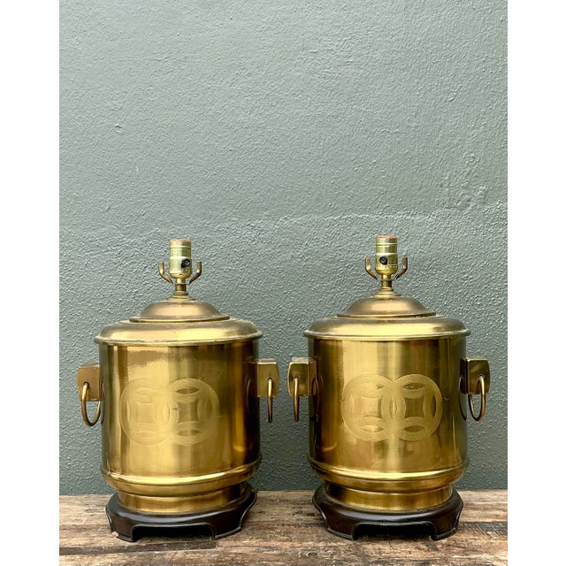 This elegant pair of table lamps epitomizes the glamorous Chinoiserie aesthetic of the Hollywood Regency era. Crafted from...
