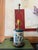A beautifully scaled Wildwood table lamp featuring a cylindrical tin base wrapped in a blue willow inspired chinoiserie...