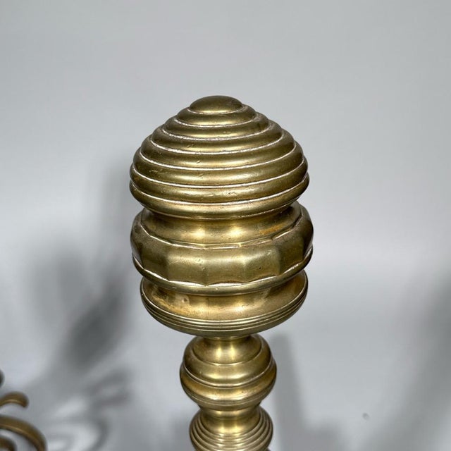 A five-piece Federal style fireplace set consisting of (i) a pair of brass andirons with tall, turned finial columns...