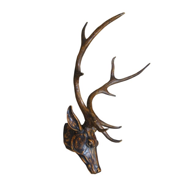 Pair of late 20th century wall hanging faux taxidermy deer / buck head sculptures with long antlers. Made of resin and...