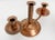 A warm and rustic pair of hammered and lightly aged copper candle holders with barley twist center stem and graceful...