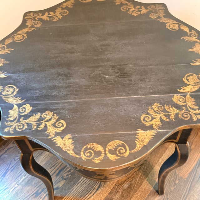 Amy Howard Parcel Gilt Side Table Shapely side table with gilt details. 35.75” x 35.75” x 29.75”
