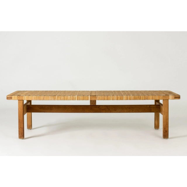 Beautiful oak and rattan bench by Børge Mogensen. Great materials, low design that works both as a bench and a coffee...