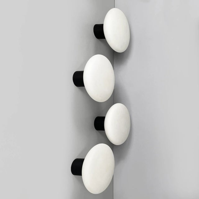 Italian mid-century modern wall lamps in opaline glass and black metal, 1950s Set of four wall lamps or ceiling lamps with...