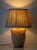 A two-handled French stoneware jar, once a working storage vessel, converted into a table lamp and finished with a new...
