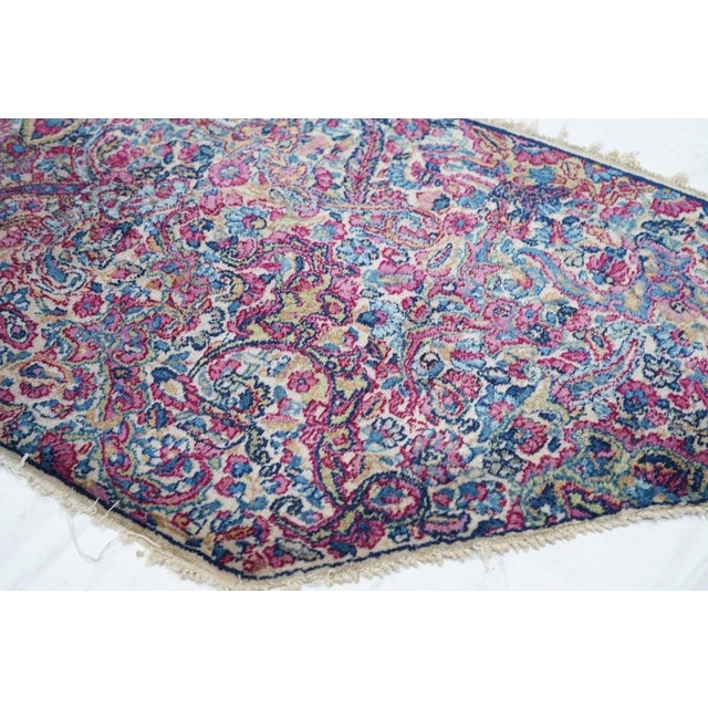 SE Persian city, famous since 17th century for an artistic variety of scatter rugs and large carpets in medallion and...