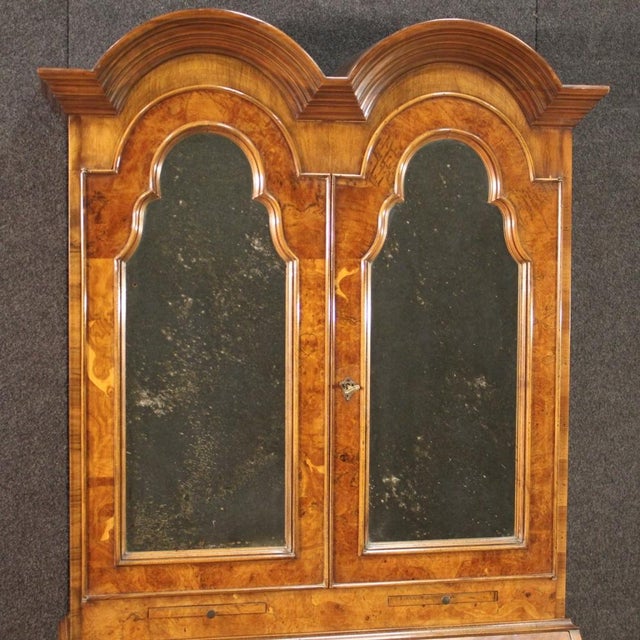 English trumeau of the 20th century. Double body funiture in walnut, burl, beech, mahogany and fruitwood. Lower body...