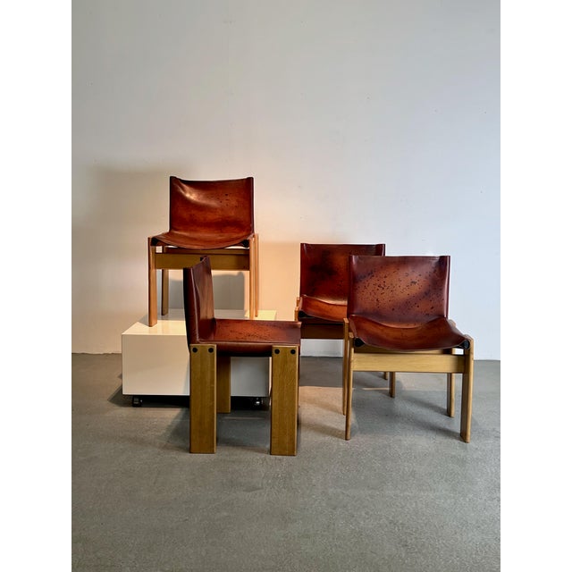 A set of four iconic dining chairs, designed by Afra and Tobia Scarpa and produced by Molteni Italy in the seventies....