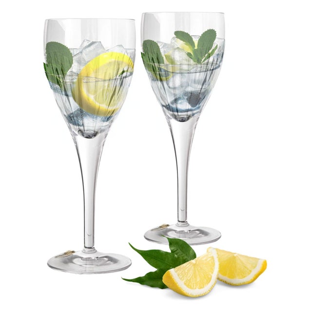 This exquisite pair of Waterford crystal goblets in the Kirin pattern showcases the brand's signature craftsmanship and...