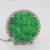 Gorgeous big carved green jade round with 0.10 ct. good quality white diamond rounds. Handmade in platinum. Metal:...
