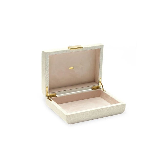 This decorative box is finished with a textured, embossed Faux Shagreen. Its curved lines have a sculptural appeal, while...