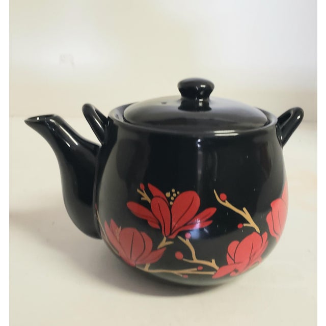Add a touch of elegant Mid-Century Asian modernism to your tea service or display shelf with this striking vintage Otagiri...