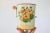 Vintage flour sifter with wood handle and floral motif. No maker mark. Stamped with the number 39 on the side. Some age...