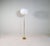 A gorgeous floor lamp made in brass with time glass shaped rod. Produced for asea this wonderful lamp was most likely...